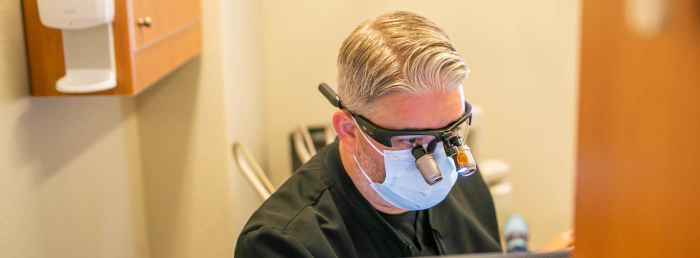 Doctor Daaboul treating a patient with restorative dentistry services in Grapevine