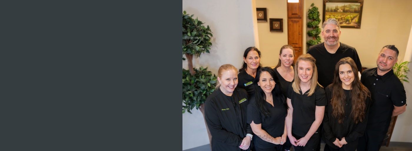 Smiling Grapevine dentist and team at Daaboul Family Aesthetic and Implant Dentistry