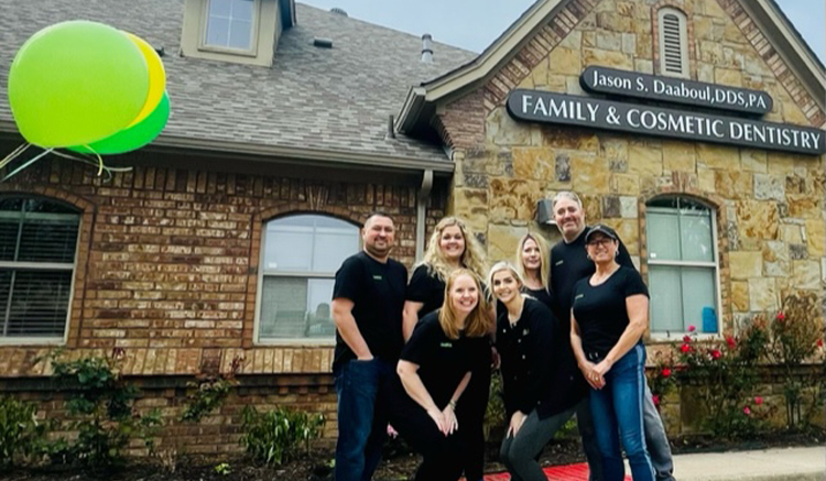 Grapevine dental team smiling outside of Daaboul Family Aesthetic and Implant Dentistry