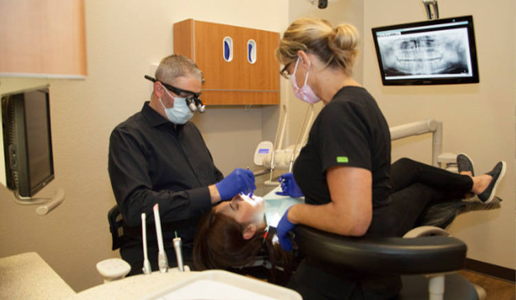 Doctor Daaboul and dental assistant treating a patient