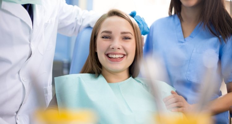 Young woman smiling in dental chair