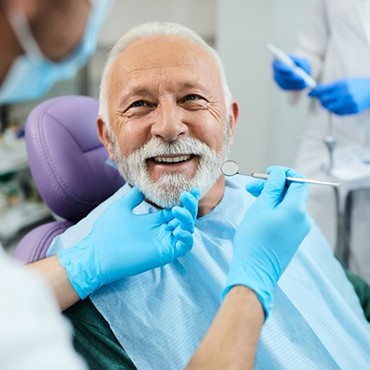 Senior dental patient undergoing checkup