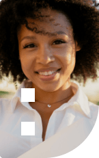 Woman in white collared shirt smiling