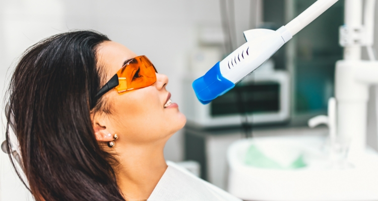 Woman in dental chair receiving professional teeth whitening in Grapevine