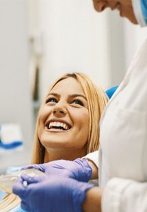 woman visiting dentist for dental checkup 