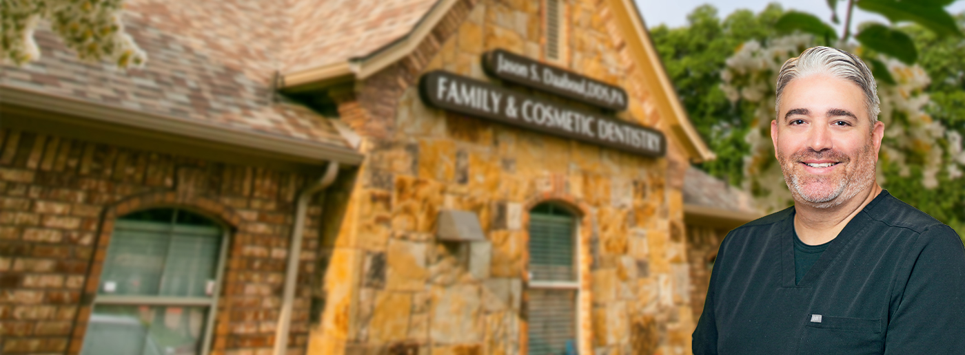 Grapevine Texas dentist Doctor Jason Daaboul smiling in front of dental office