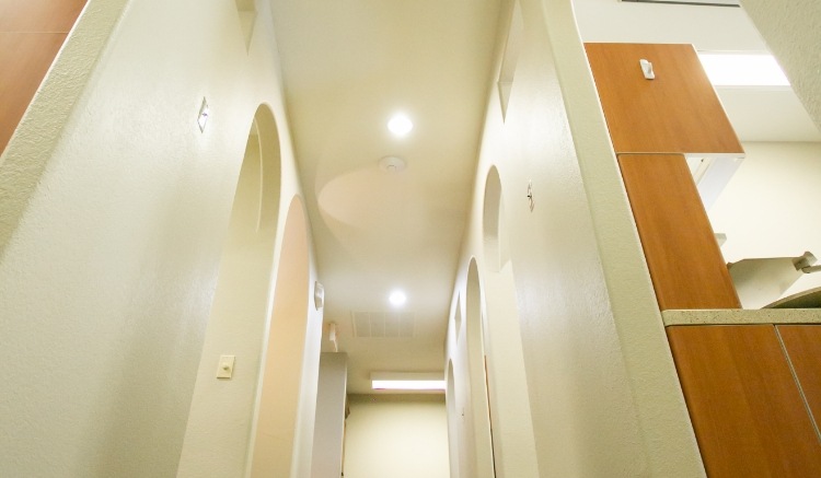 Hallway with white walls and ceiling