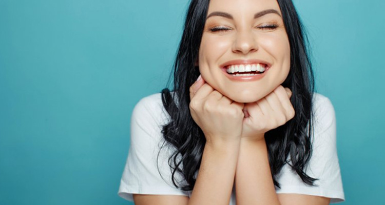 Lady smiles with pretty teeth